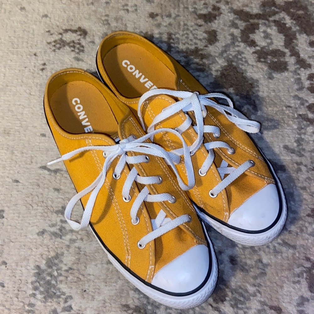 Mustard colored slip-on converse